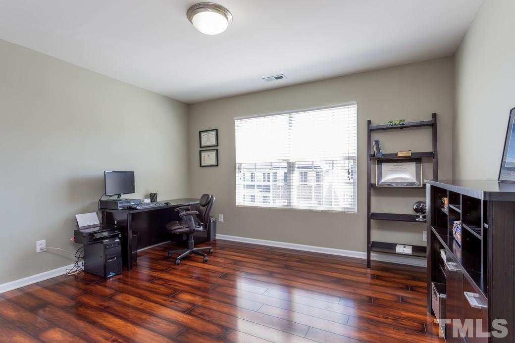 4357 Karlbrook Lane Raleigh, NC 27616 - Photo 18 of 25 a workspace with furniture hardwood and a window