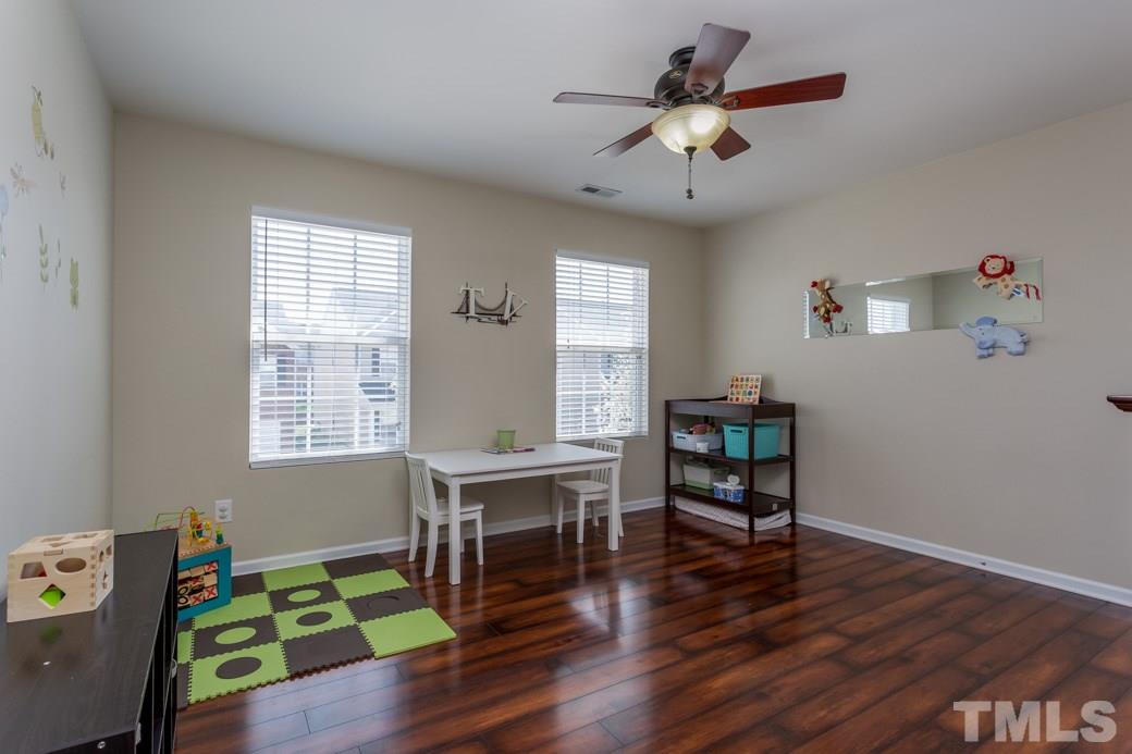 4357 Karlbrook Lane Raleigh, NC 27616 - Photo 19 of 25 a living room with furniture and a window