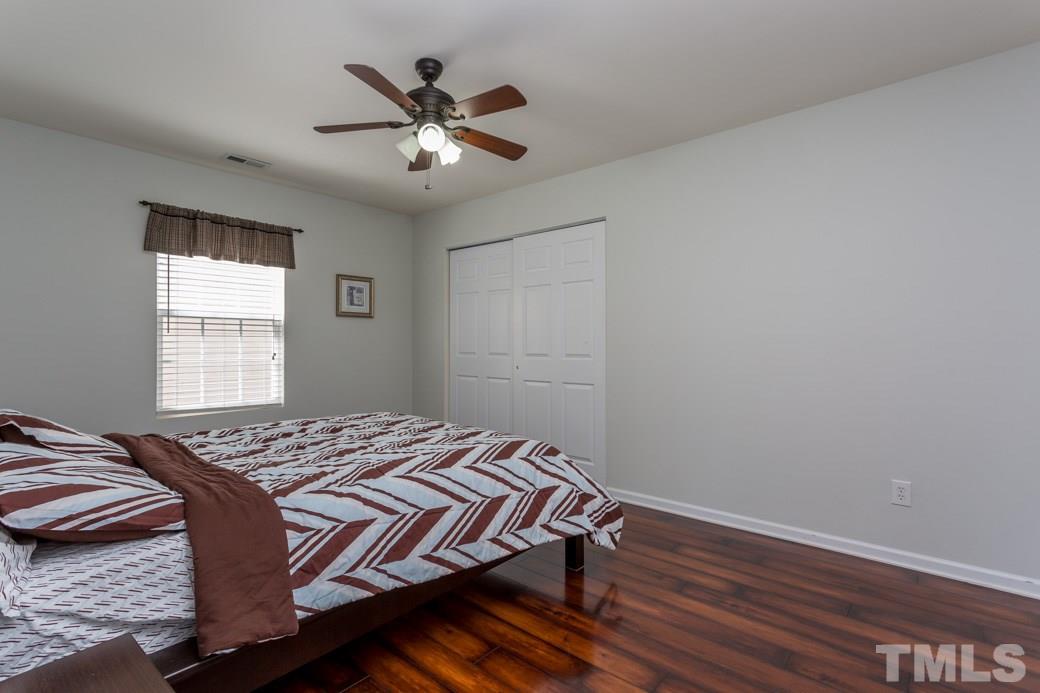 4357 Karlbrook Lane Raleigh, NC 27616 - Photo 20 of 25 a bedroom with a bed and a window
