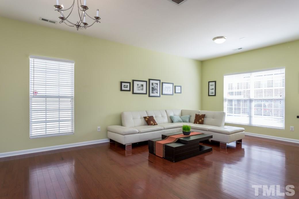 4357 Karlbrook Lane Raleigh, NC 27616 - Photo 3 of 25 a living room with furniture and a large window