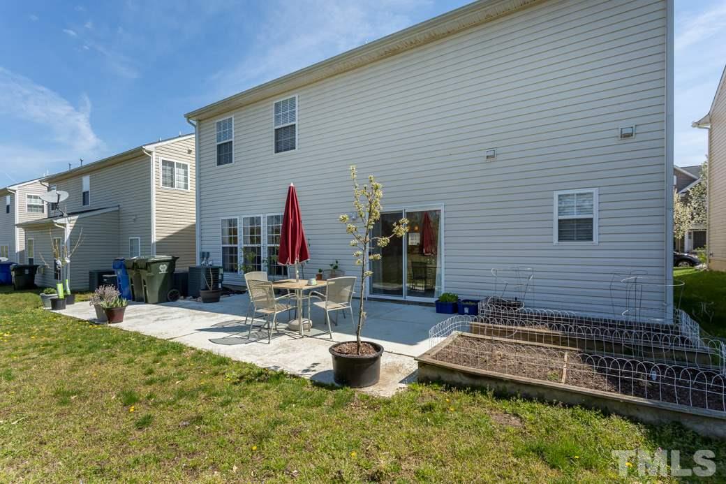 4357 Karlbrook Lane Raleigh, NC 27616 - Photo 24 of 25 a view of a house with backyard and sitting area