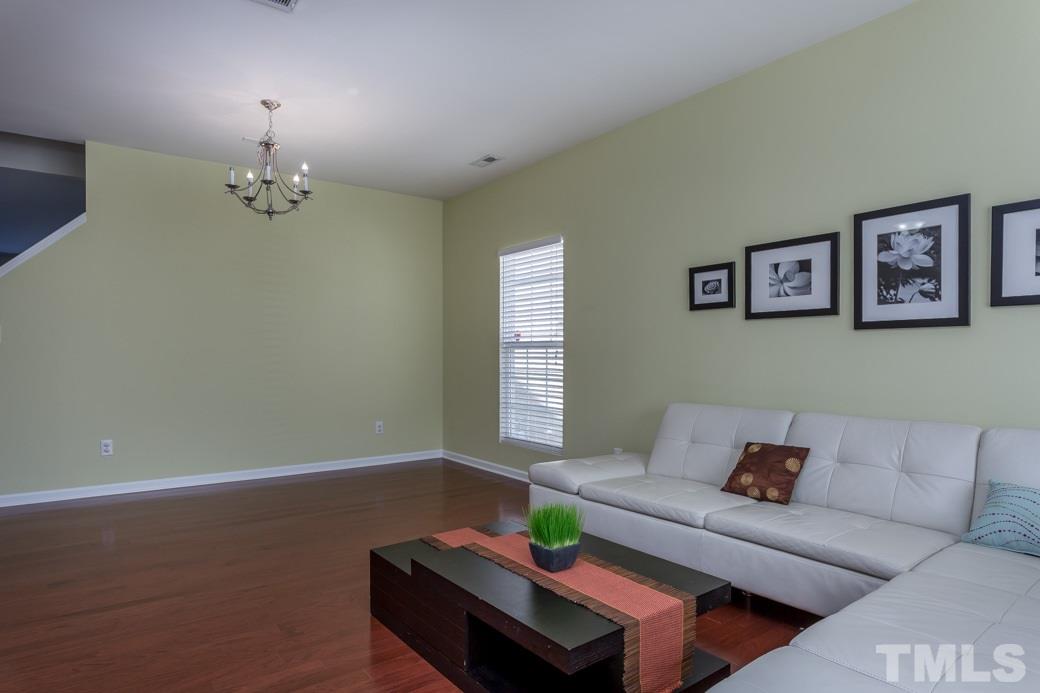 4357 Karlbrook Lane Raleigh, NC 27616 - Photo 4 of 25 a living room with furniture and a window
