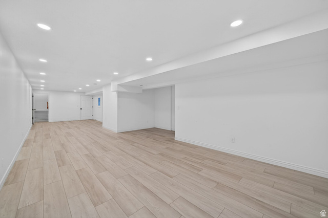 6969 South 855 East Midvale, UT 84047 - Photo 32 of 55 Spacious room featuring wood-finish flooring, recessed lighting, white walls, and white baseboards