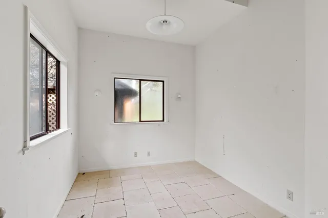 a kitchen with a stove a sink and a microwave