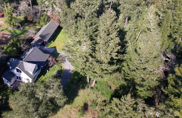 a aerial view of a house with a yard