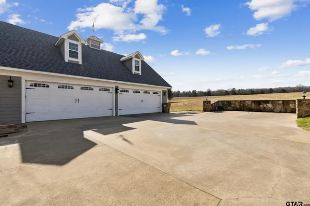 a view of residential houses with outdoor space and lake view