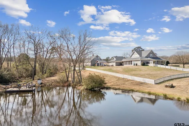 a view of a patio with a table and chairs