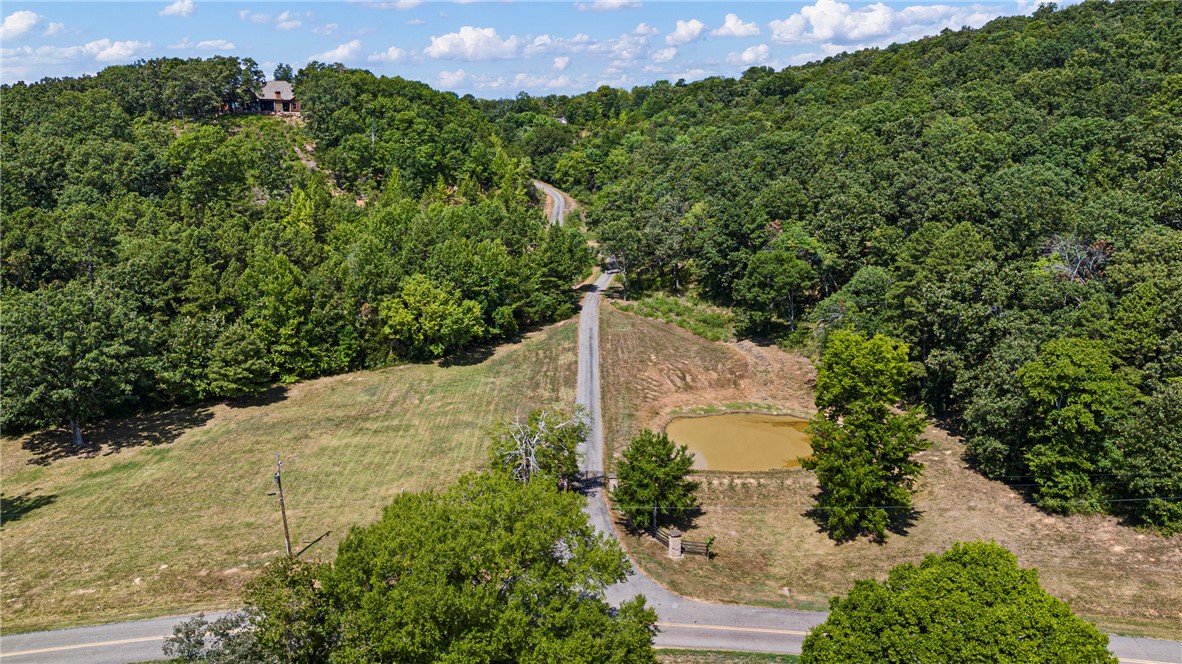 3419 Bailey Loop Road London, AR 72847 - Photo 56 of 60 Wooded hillside property featuring a private pond and a distant structure