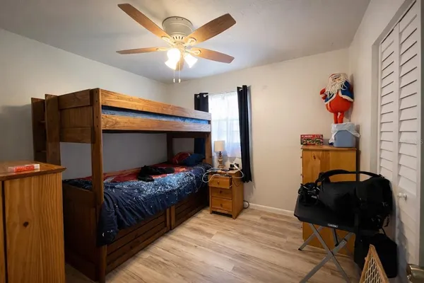 a bedroom with bed and tv