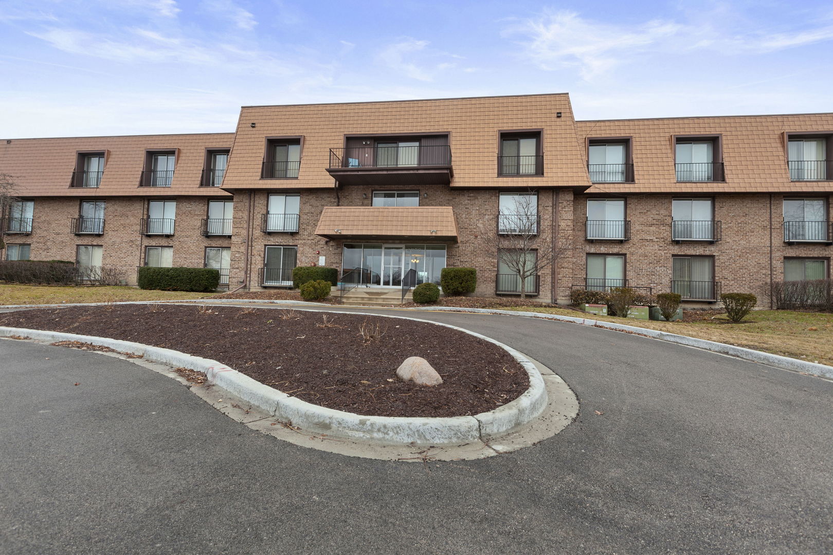 4050 Dundee Road, Unit 105 Northbrook, IL 60062 - Photo 1 of 18 a view of building with a lot of windows
