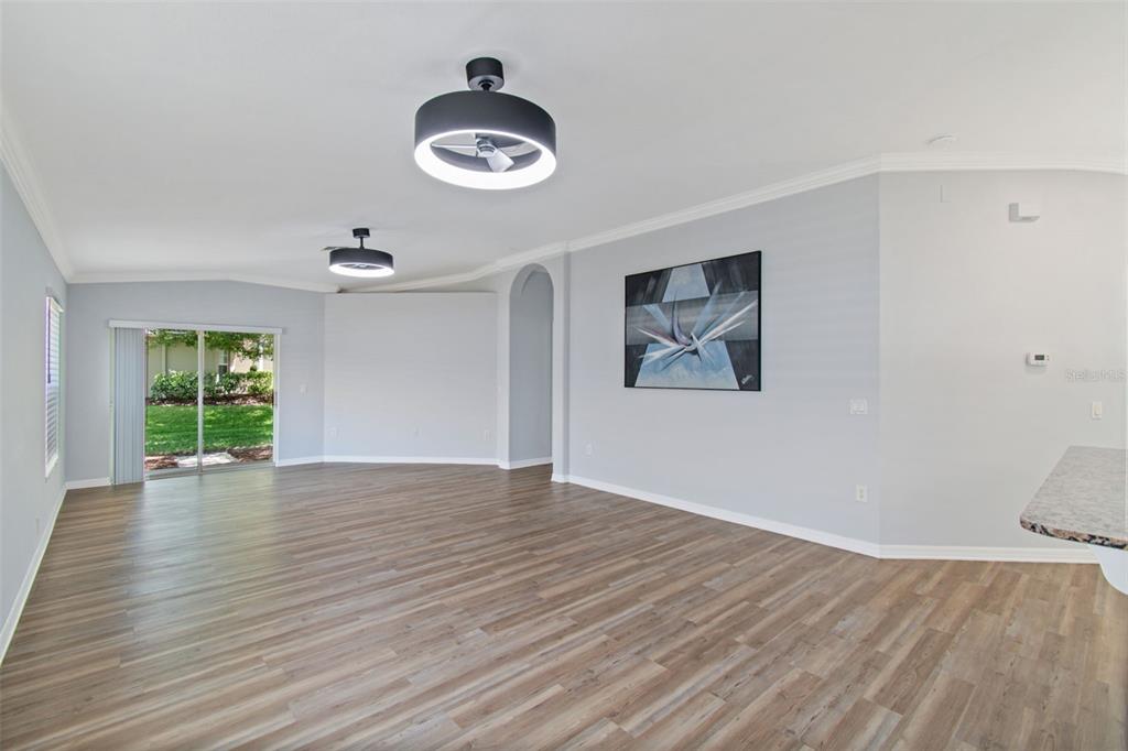18630 Rolling Hills Loop Hudson, FL 34667 - Photo 15 of 64 wooden floor in an empty room with a window