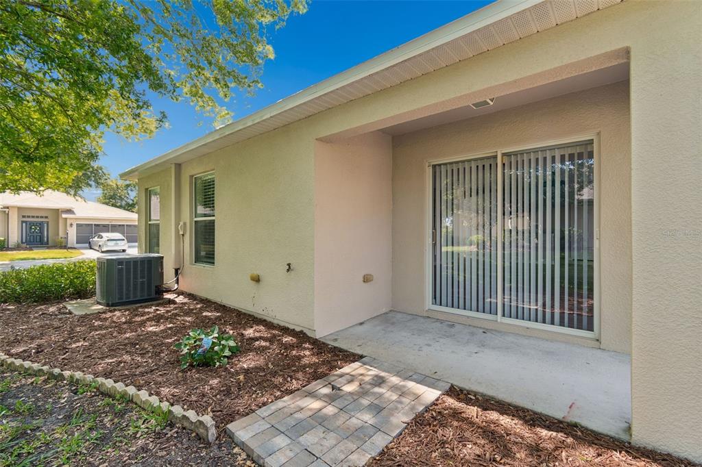 18630 Rolling Hills Loop Hudson, FL 34667 - Photo 30 of 64 a view of a house with a backyard