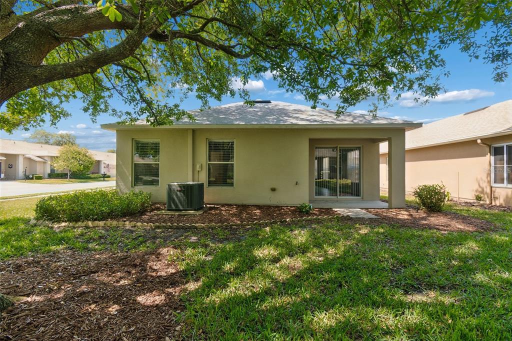 18630 Rolling Hills Loop Hudson, FL 34667 - Photo 31 of 64 a view of a house with a yard