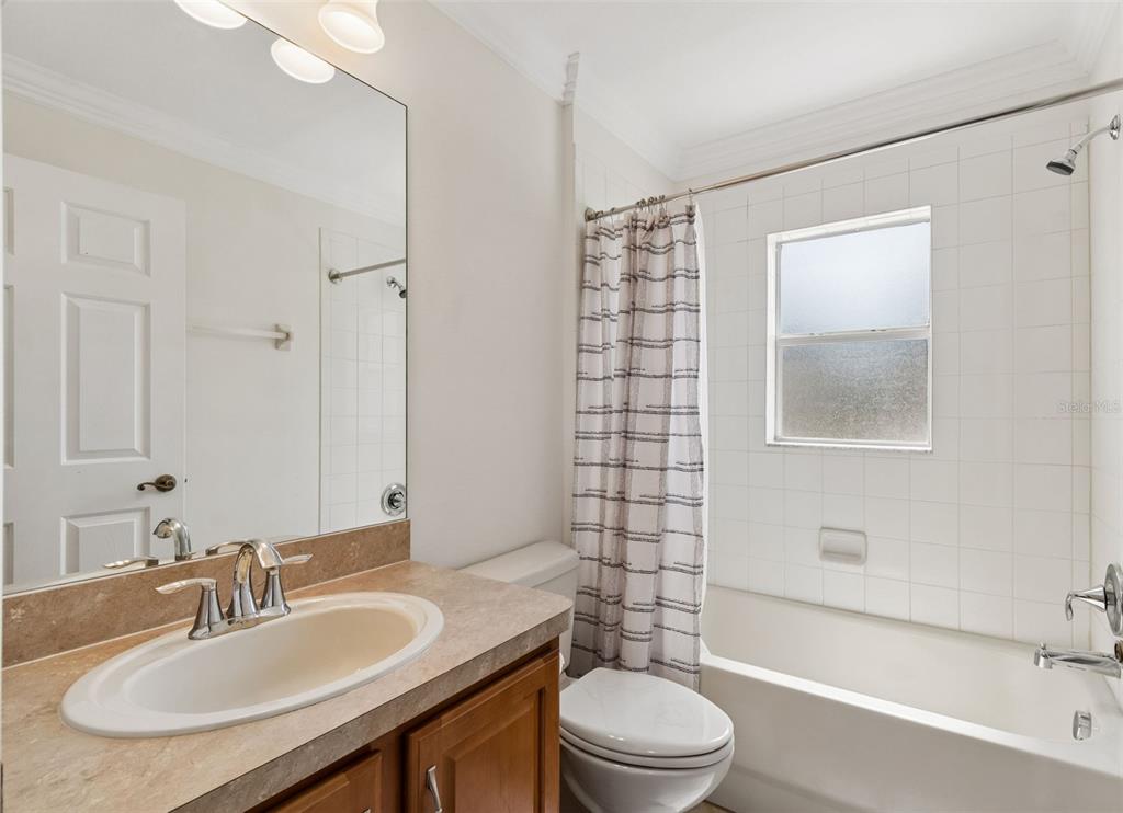 18630 Rolling Hills Loop Hudson, FL 34667 - Photo 10 of 64 a bathroom with a sink a toilet and shower