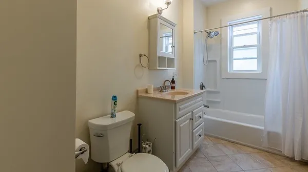 a bedroom with a bed and a table in it