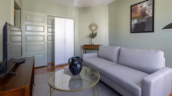 a bedroom with a bed and a table in it