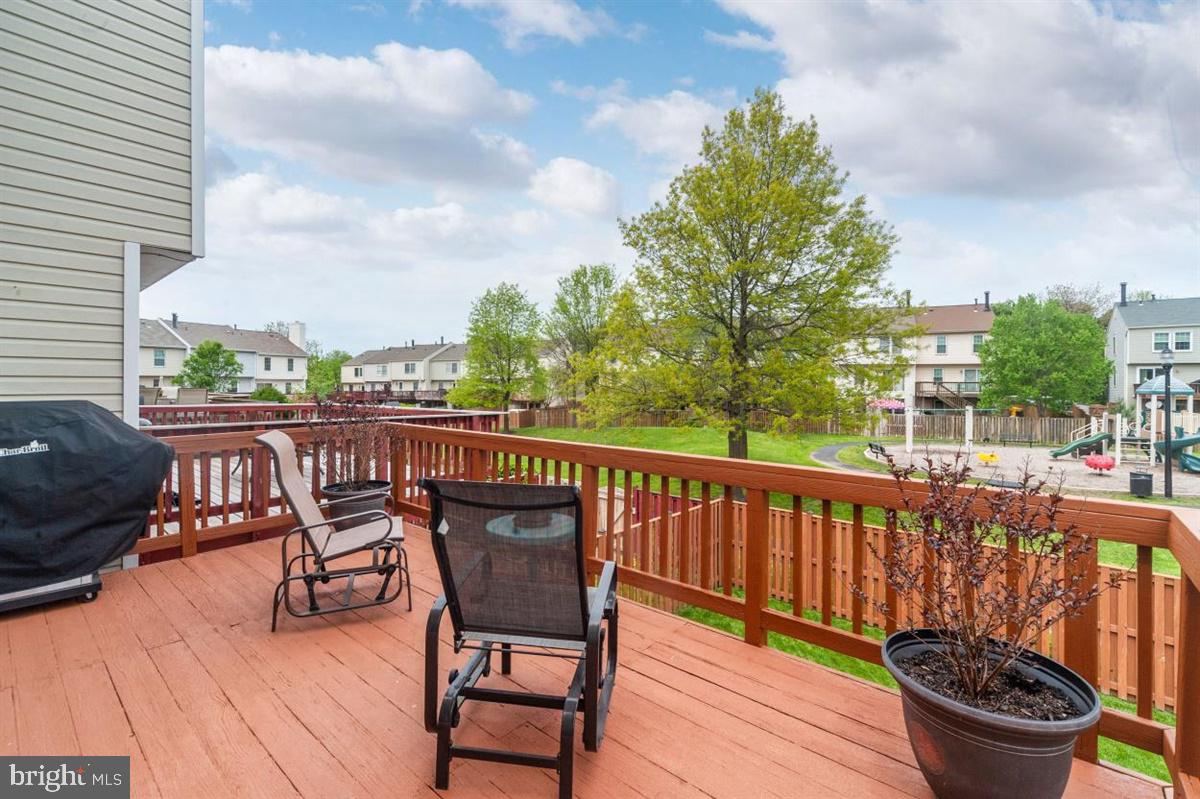 2479 Warm Spring Way Odenton, MD 21113 - Photo 26 of 34 Freshly stained deck with view of tot lot