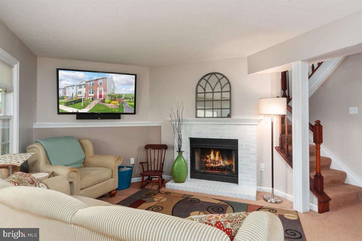 2479 Warm Spring Way Odenton, MD 21113 - Photo 4 of 34 Relaxing family room w/ wood-burning fireplace