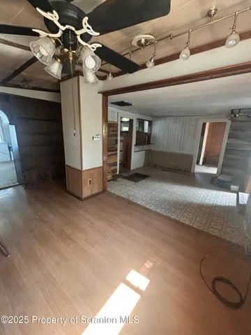 a large kitchen with stainless steel appliances granite countertop a sink and a counter space