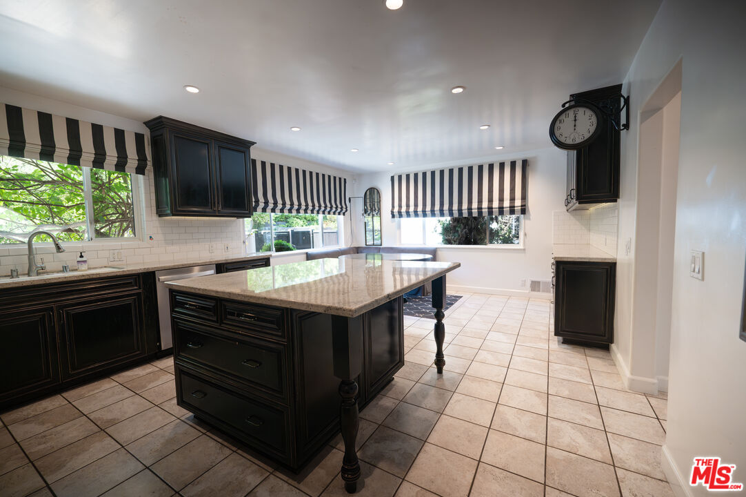 503 North Greencraig Road Los Angeles, CA 90049 - Photo 13 of 59 a kitchen with a sink cabinets and appliances