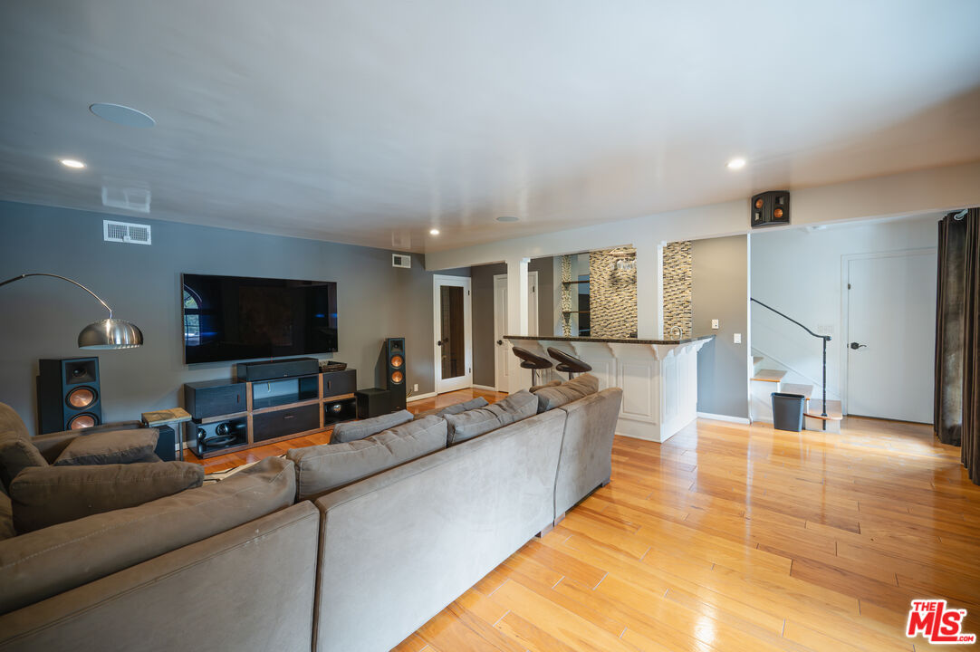 503 North Greencraig Road Los Angeles, CA 90049 - Photo 21 of 59 a living room with furniture and a flat screen tv