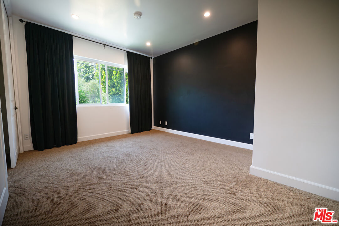 503 North Greencraig Road Los Angeles, CA 90049 - Photo 40 of 59 a view of an empty room with a window