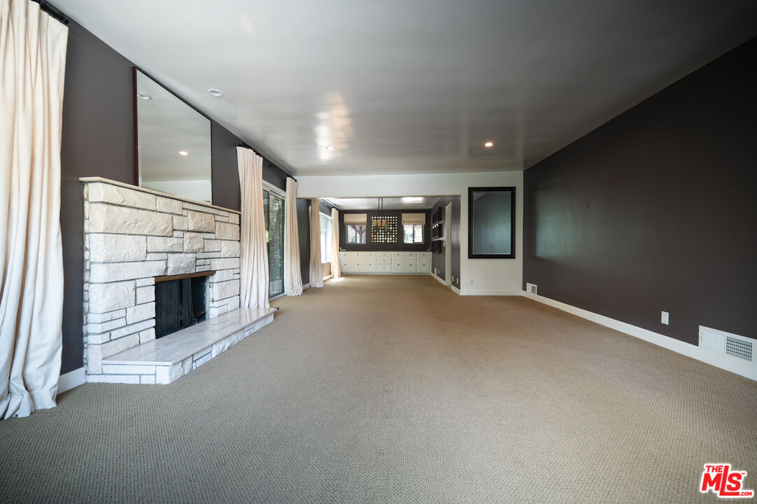 503 North Greencraig Road Los Angeles, CA 90049 - Photo 7 of 59 a view of a livingroom with a fireplace