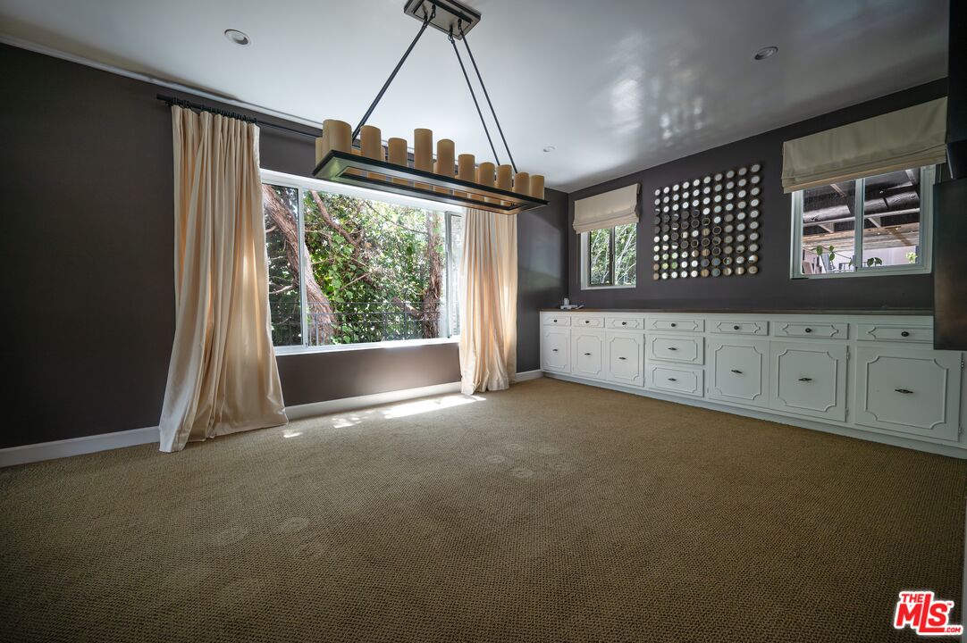 503 North Greencraig Road Los Angeles, CA 90049 - Photo 10 of 59 a view of an empty room with a window
