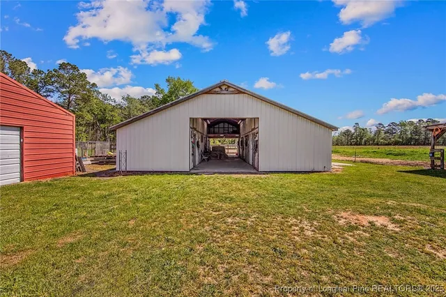 a view of a backyard with large trees