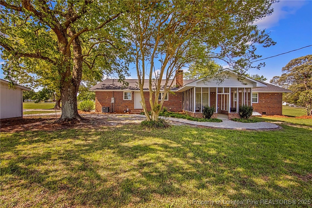 40 Kinlaw Road Lumberton, NC 28358 - Photo 2 of 50 a front view of a house with a yard table and chairs