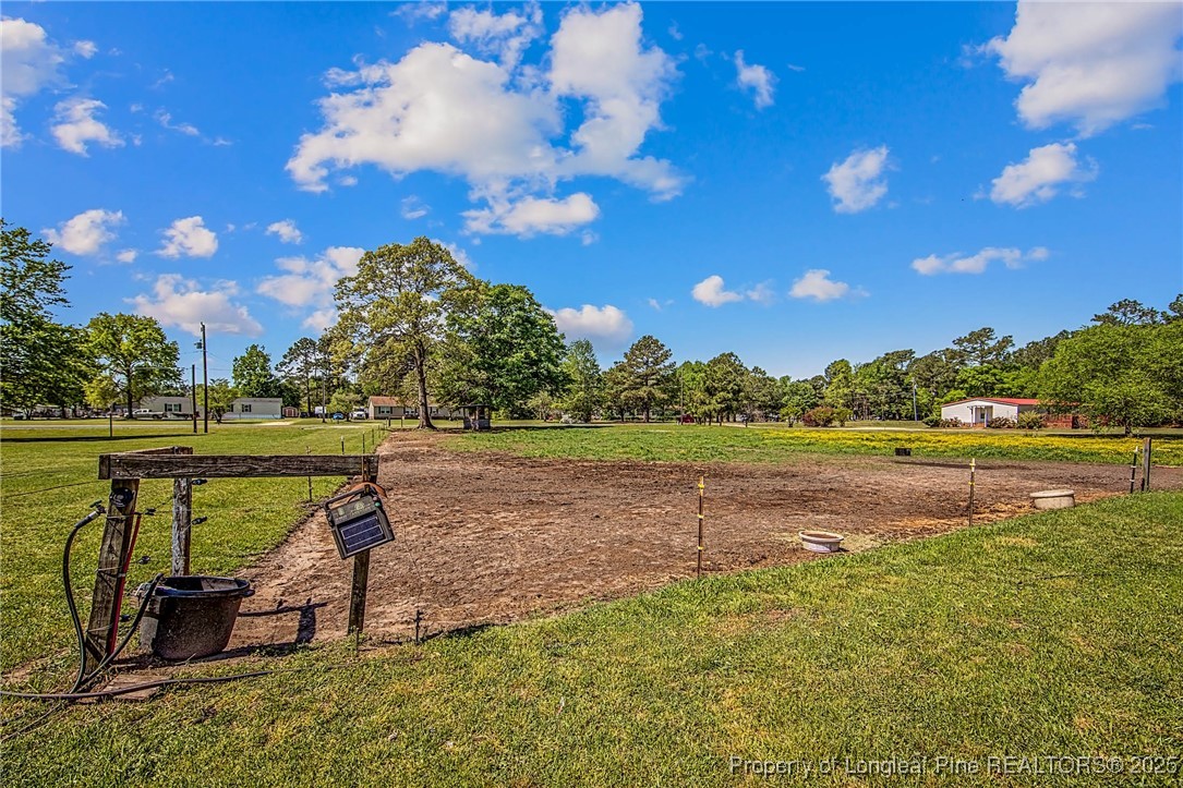 40 Kinlaw Road Lumberton, NC 28358 - Photo 28 of 50 a view of a lake with a yard