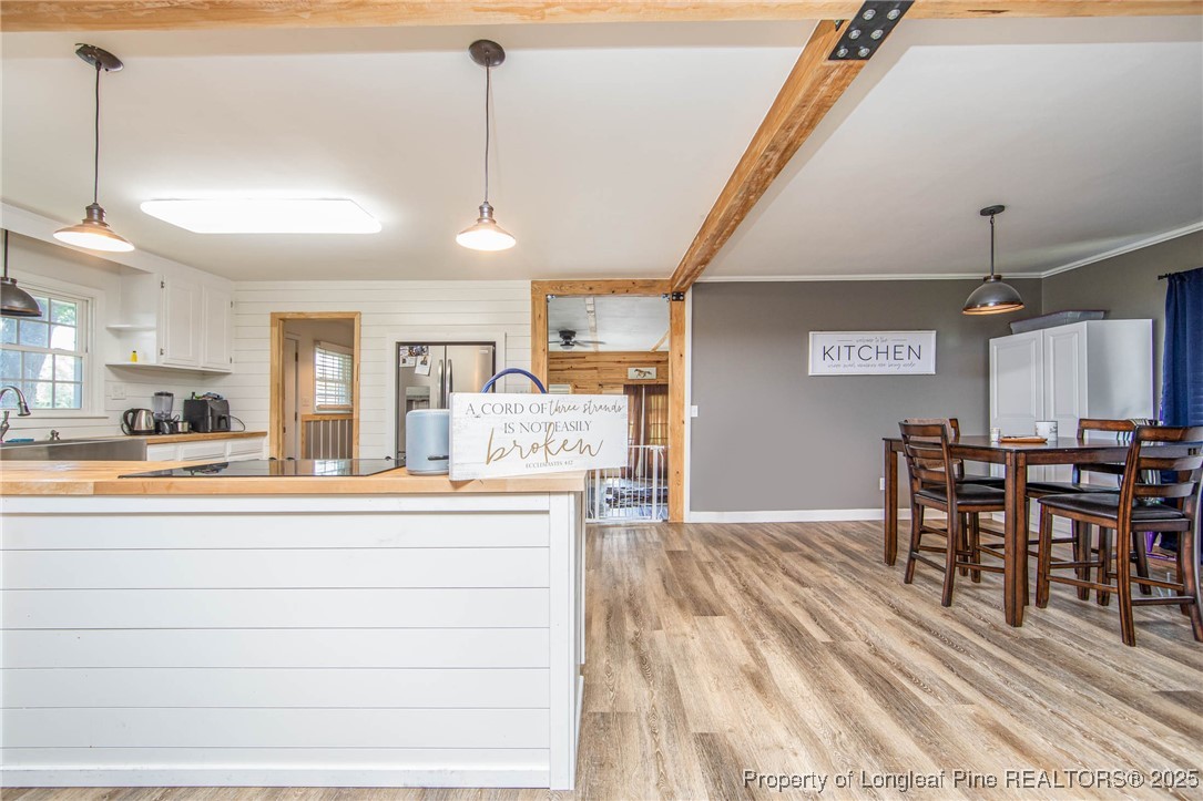 40 Kinlaw Road Lumberton, NC 28358 - Photo 34 of 50 a view of a dining room and livingroom with furniture wooden floor a chandelier