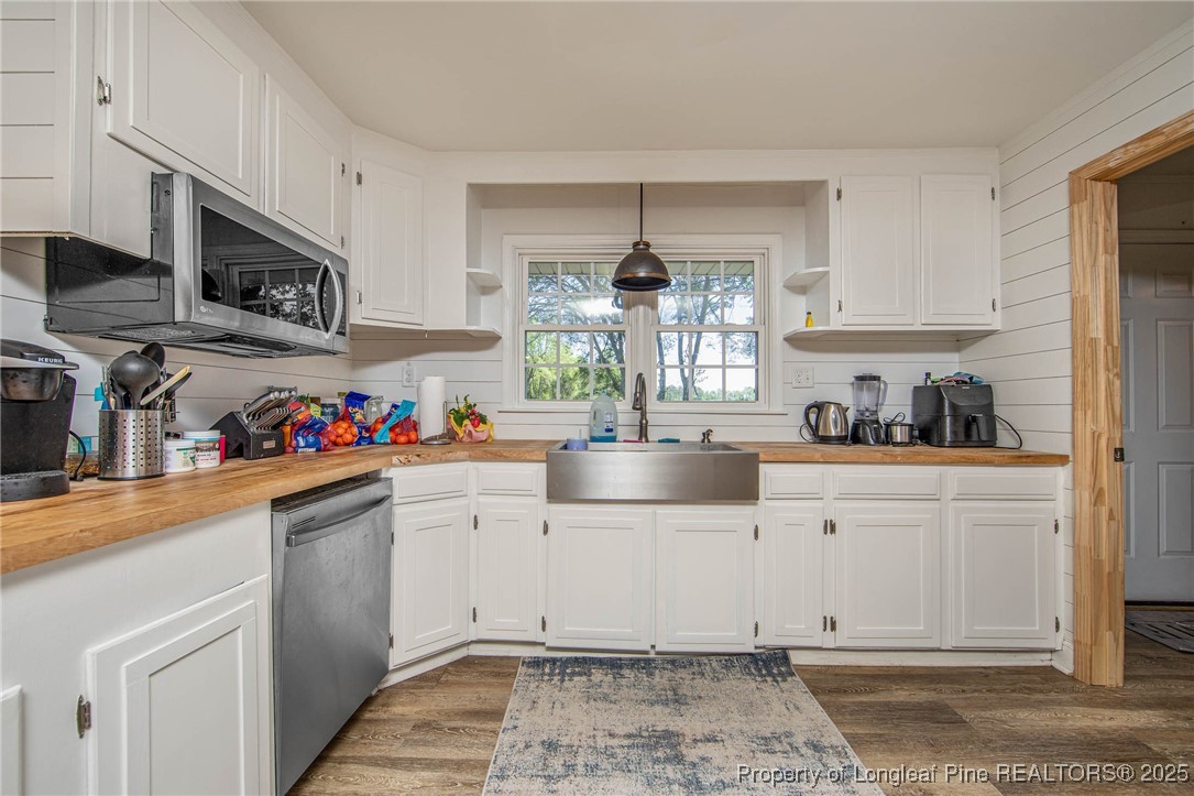 40 Kinlaw Road Lumberton, NC 28358 - Photo 38 of 50 a kitchen with stainless steel appliances granite countertop a sink and cabinets