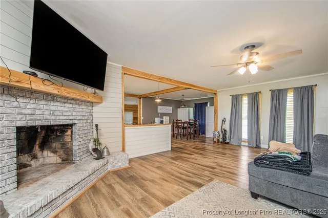 a living room with furniture and a fireplace