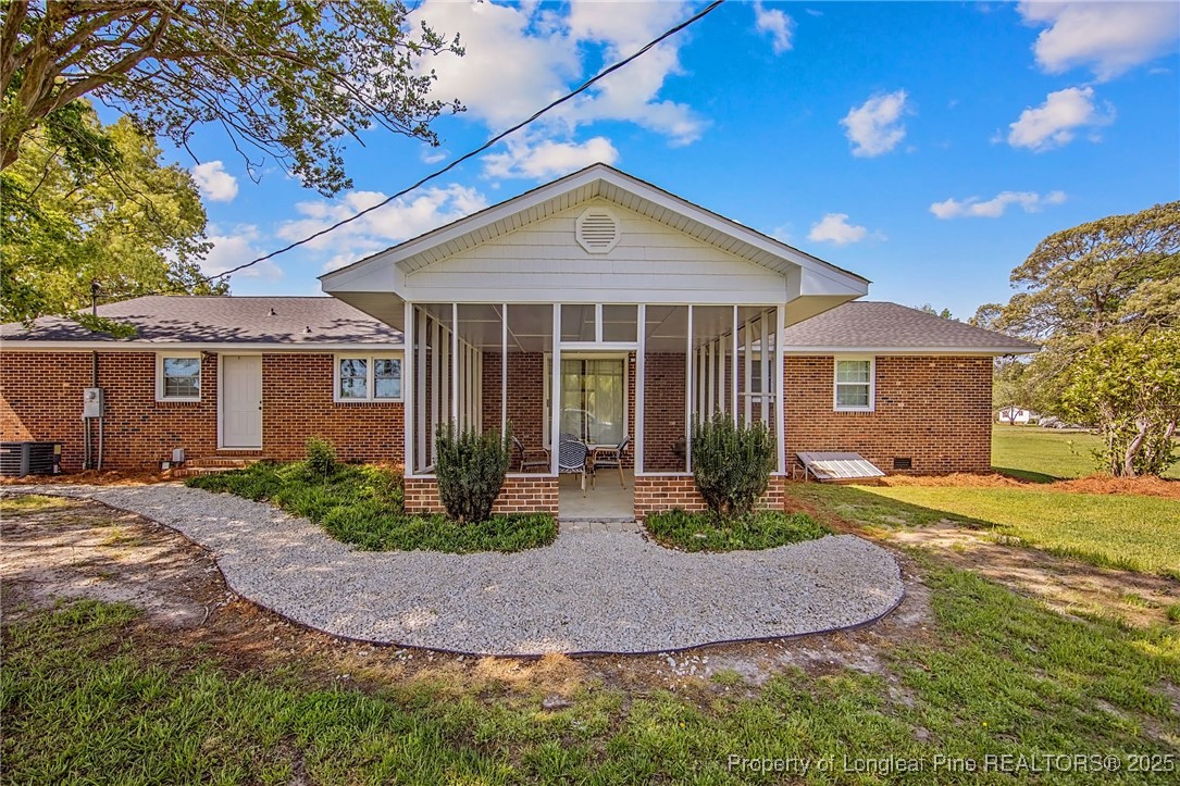 40 Kinlaw Road Lumberton, NC 28358 - Photo 4 of 50 a front view of a house with garden