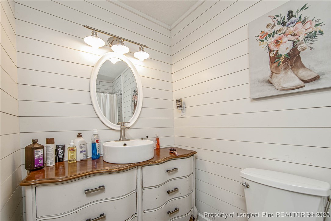 40 Kinlaw Road Lumberton, NC 28358 - Photo 44 of 50 a bathroom with a sink and a mirror