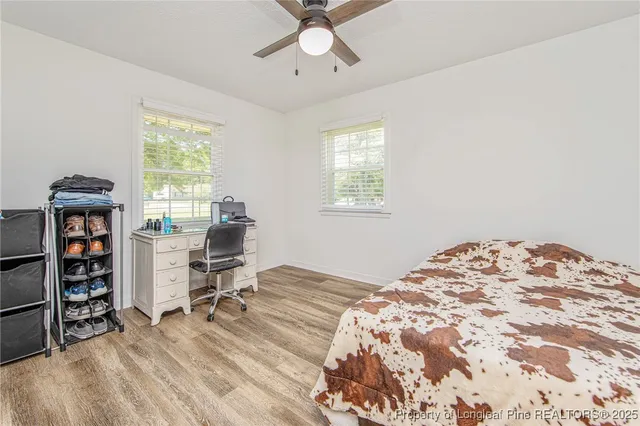 a bedroom with a bed and a chair