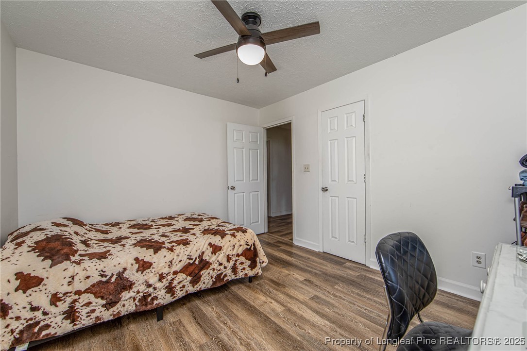 40 Kinlaw Road Lumberton, NC 28358 - Photo 46 of 50 a bedroom with a bed and a chair