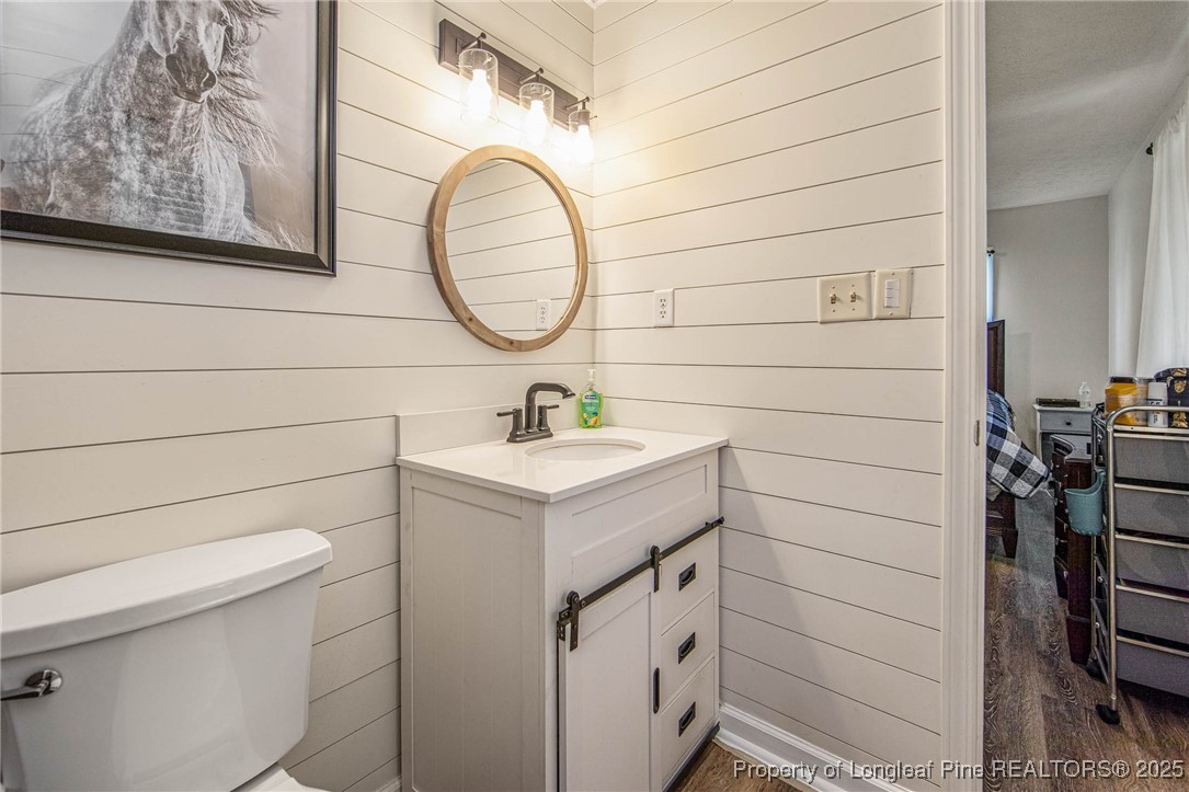 40 Kinlaw Road Lumberton, NC 28358 - Photo 48 of 50 a bathroom with a sink a toilet and a mirror
