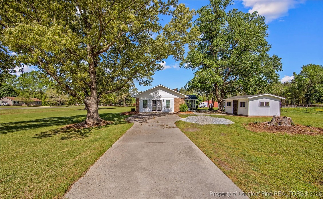 40 Kinlaw Road Lumberton, NC 28358 - Photo 8 of 50 a front view of a house with a yard