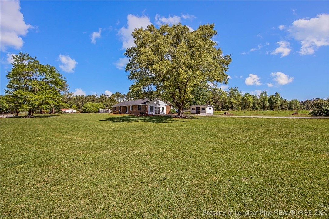 40 Kinlaw Road Lumberton, NC 28358 - Photo 10 of 50 a view of a field with an trees
