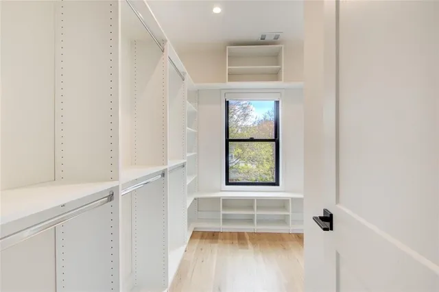 a view of entryway with window and wooden floor