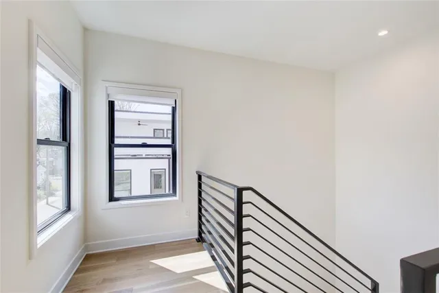 a view of a hallway with windows