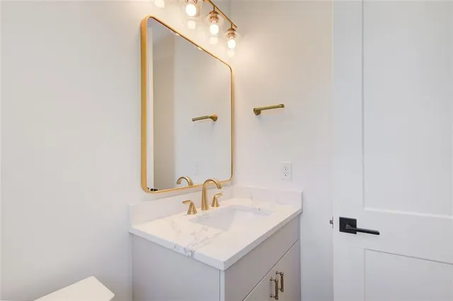 a bathroom with a sink and mirror