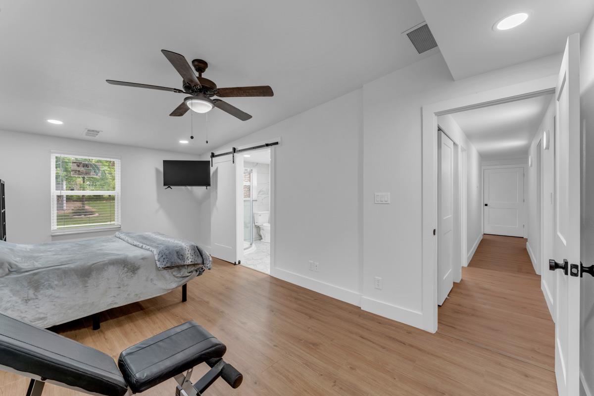 407 East Kerr Street Burnet, TX 78611 - Photo 11 of 21 a living room with couch and a window