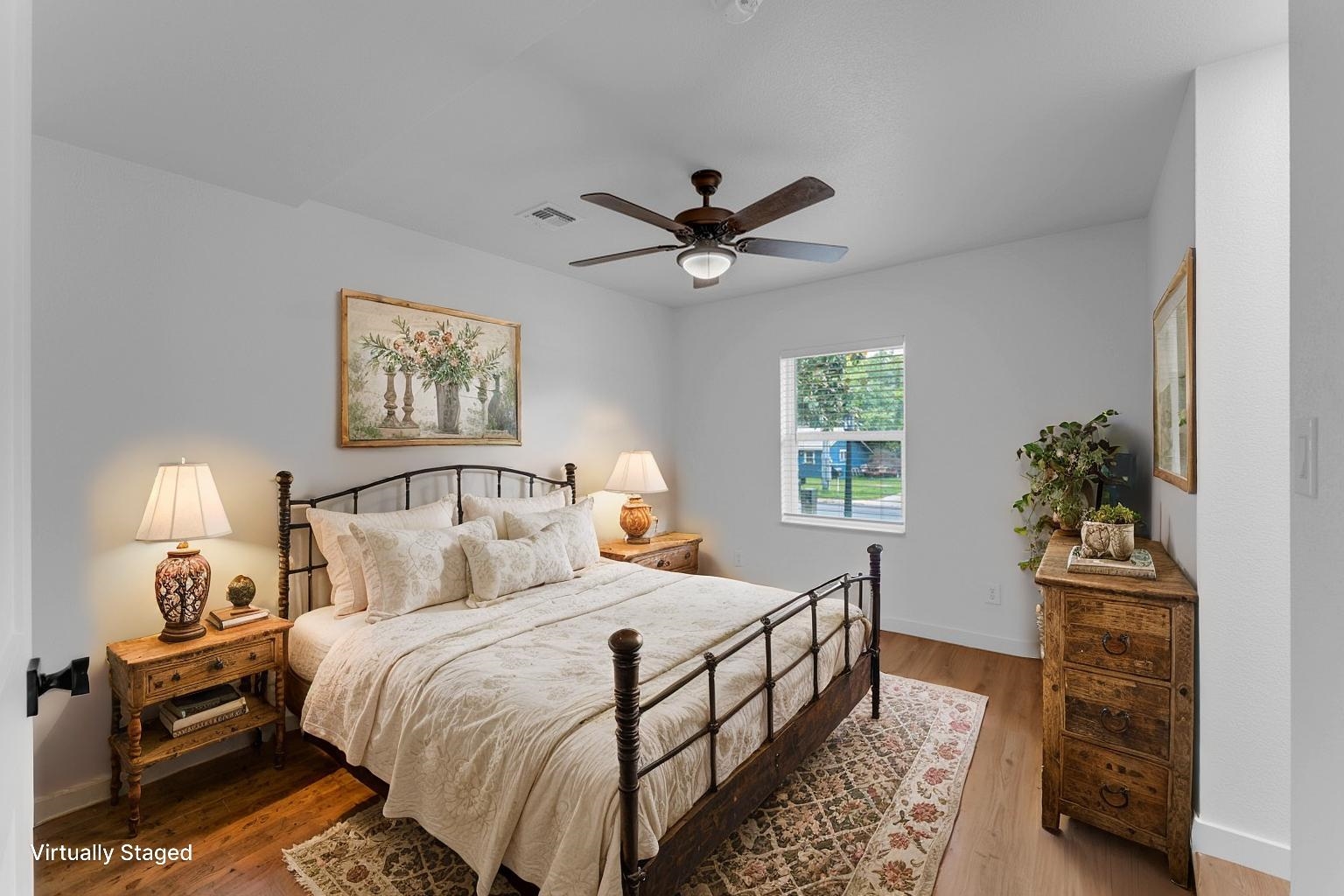 407 East Kerr Street Burnet, TX 78611 - Photo 14 of 21 a bedroom with bed and a chandelier