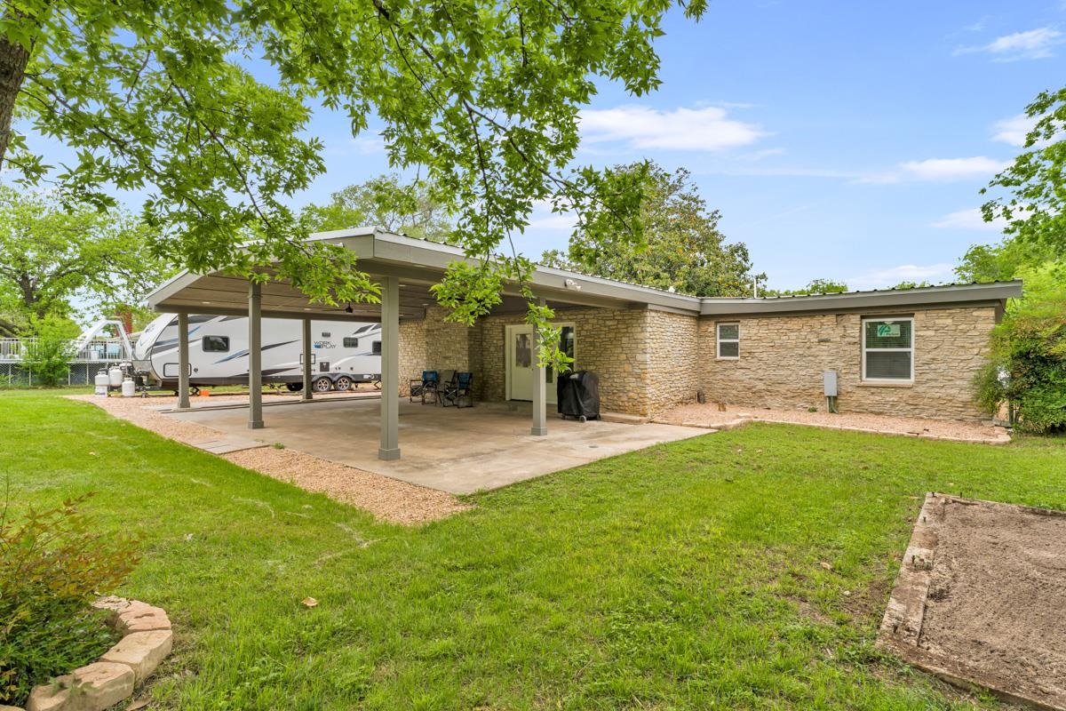 407 East Kerr Street Burnet, TX 78611 - Photo 21 of 21 a view of a house with backyard and sitting area