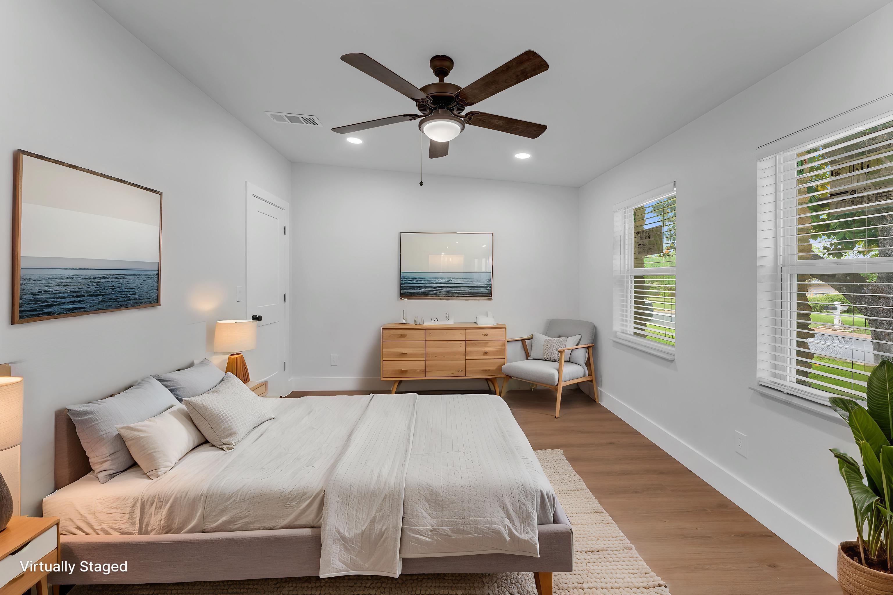 407 East Kerr Street Burnet, TX 78611 - Photo 10 of 21 a bedroom with a large bed and a window