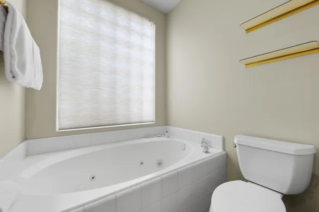 a view of a house with swimming pool and porch