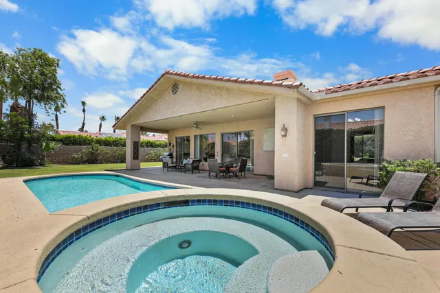 a view of a swimming pool with a patio